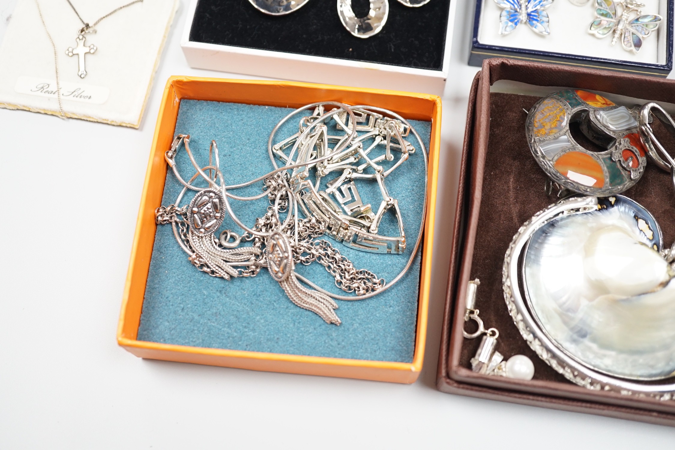 Mixed silver and white metal jewellery including a modern silver nurses buckle, an early 20th century white metal and Scottish hardstone brooch, Chinese white metal buckle by Wang Hing, etc.